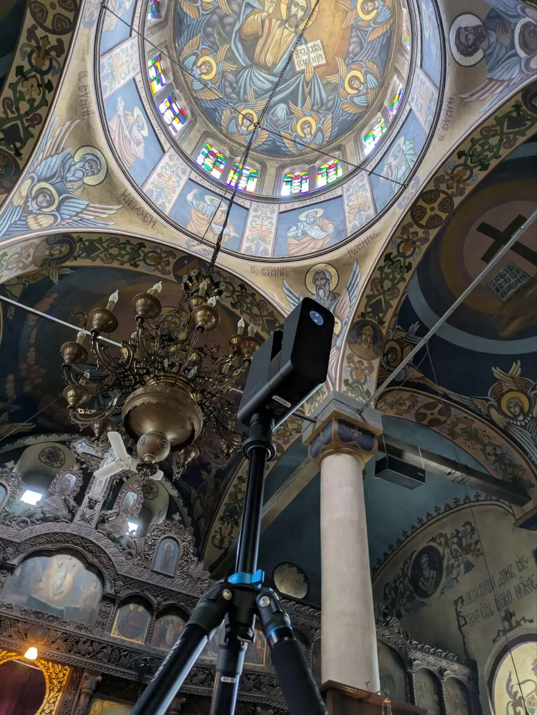 The murals and stained glass of the dome, captured from inside