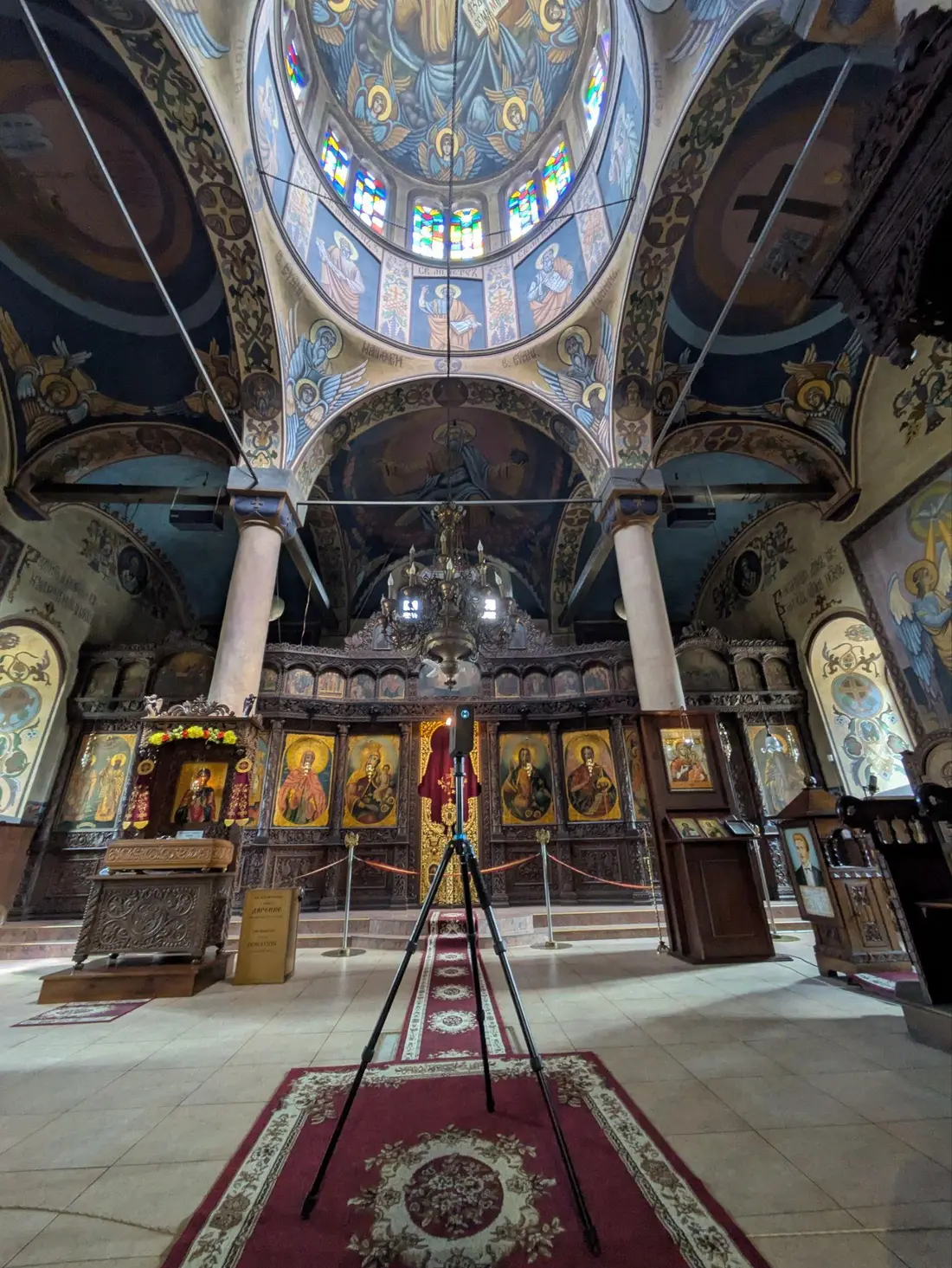 Laser scanner in front of the iconostasis inside the church
